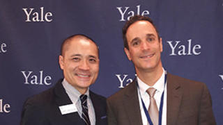 Glen Gechlik ’05 M.B.A. (right) receiving a Yale Leadership Award from the Yale Alumni Association with Henry Kwan ’05 M.A. (left) director for Shared Interest Groups at YAA.