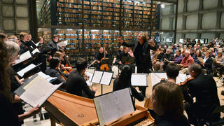 Orchestra and mistro in a room
