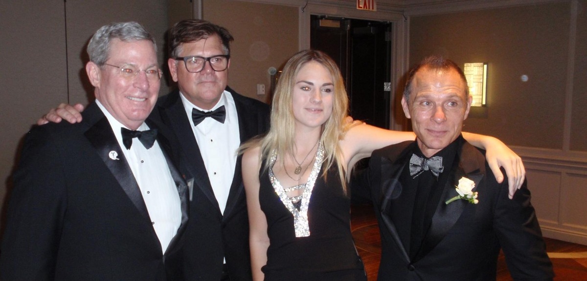 Kevin Czinger '81 (far right, with, left to right, John Rogan, Jeff Rohrer, and Isabella Rohrer) was the Yale honoree at the 2019 Ivy Football Association Dinner.