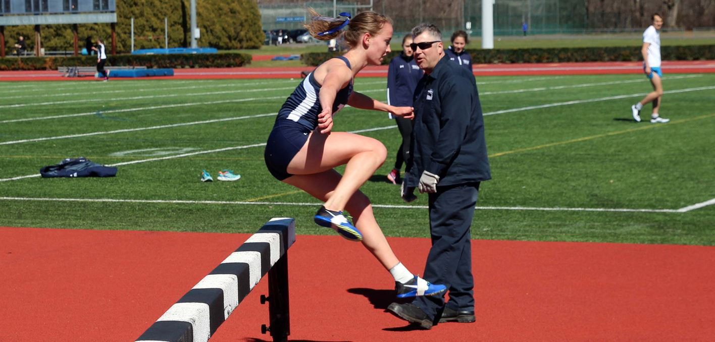 Photo of Meredith Rizzo '17 jumping track hurdle 