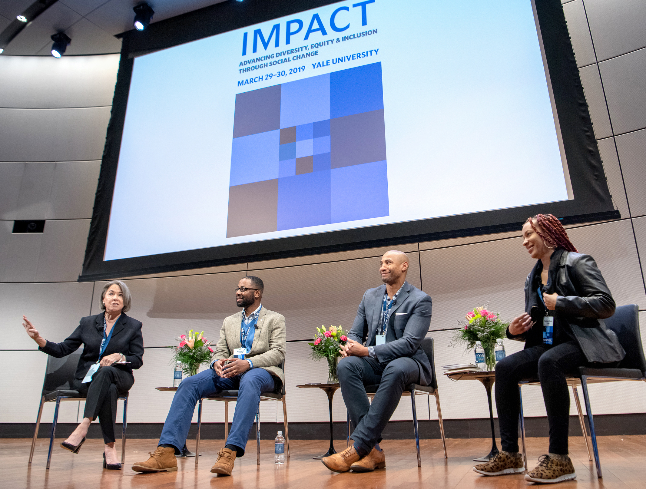 Panelists sit on the stage during the 2019 IMPACT Conference