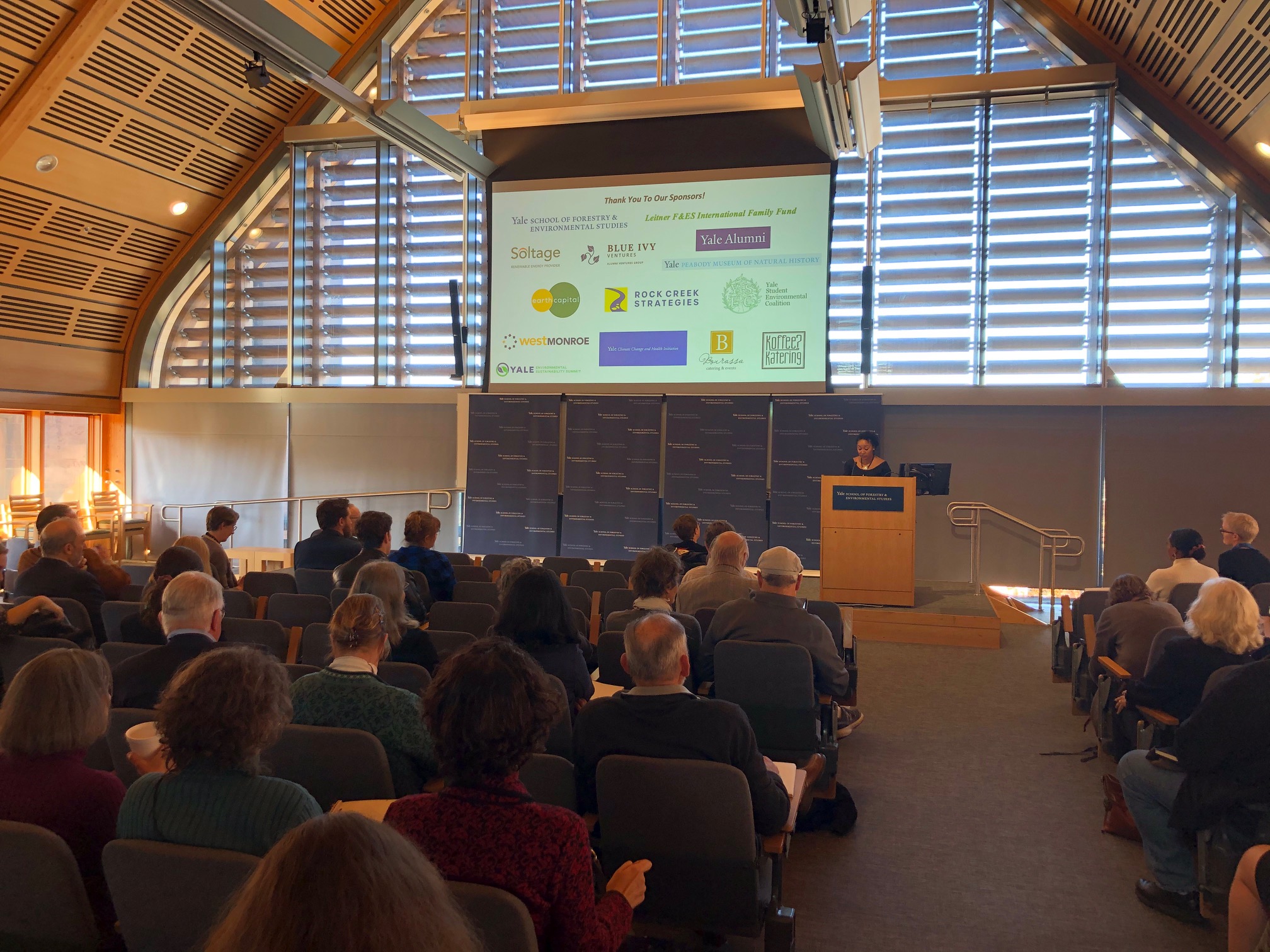 Lauren E. Graham ’13 MEM, chair of Yale Blue Green, thanks campus partners and external sponsors who supported the Yale Environmental Sustainability Summit. Photo: Henry Kwan