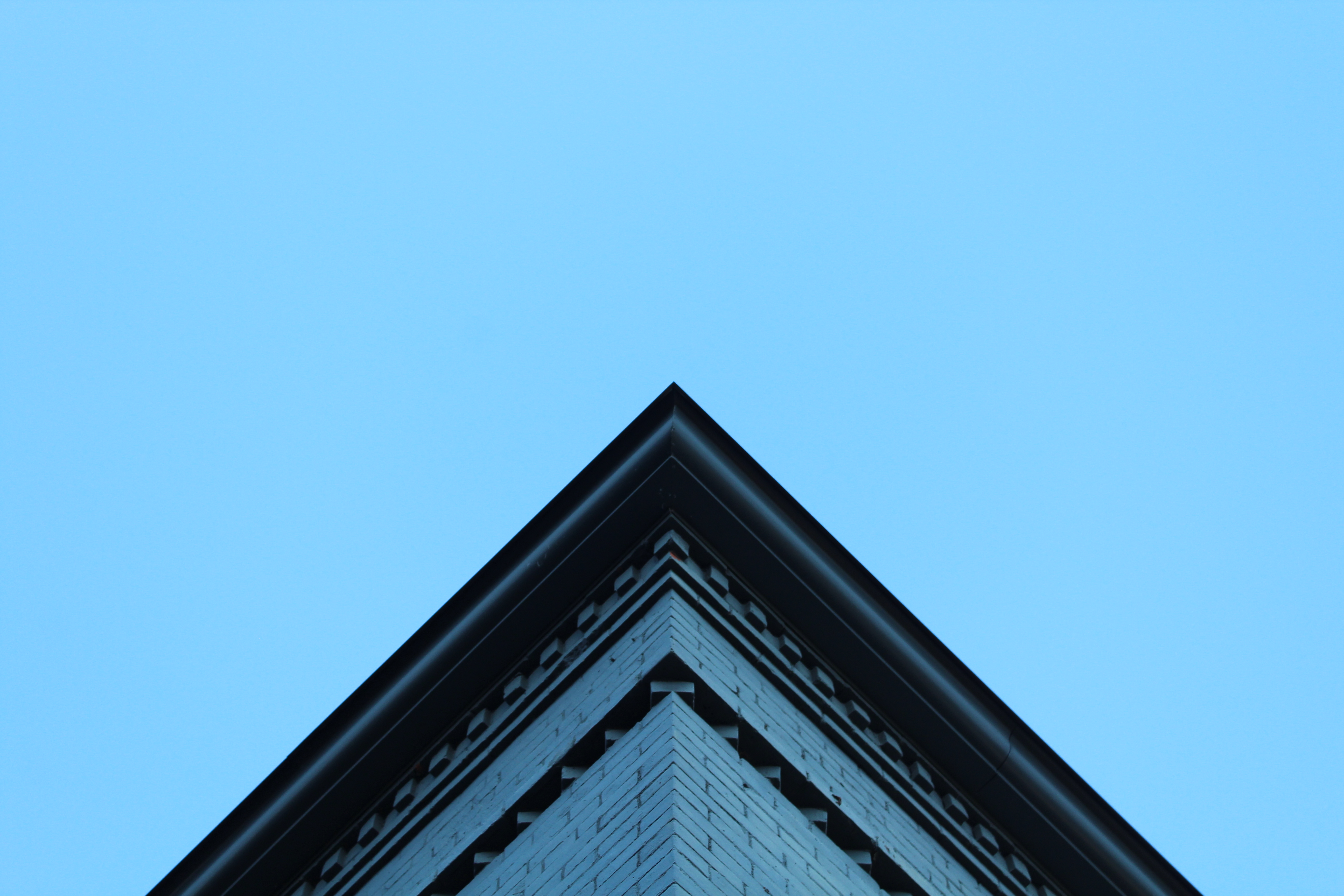 Founders Hall roof against a blue spring sky.