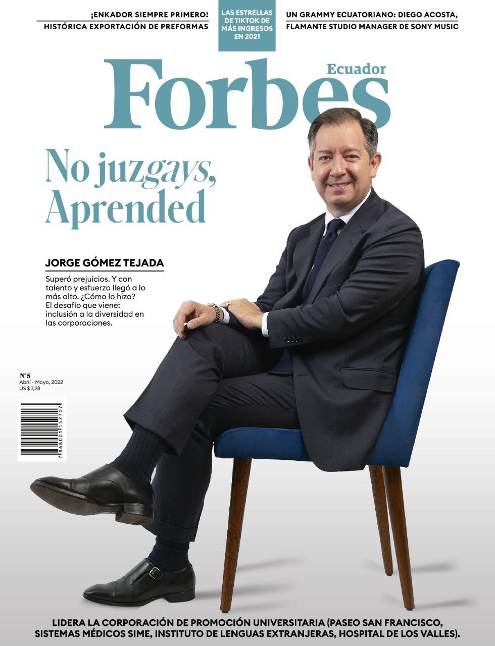 Jorge Gómez Tejada ’07 MAR, ’12 PhD poses, sitting on a chair with his legs crossed, for the cover of Forbes Ecuador