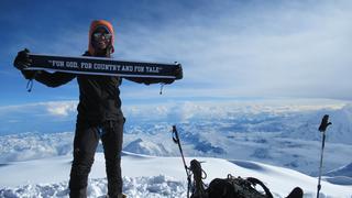 Abby Gahm '17 raises the Yale flag at the top of Denali.