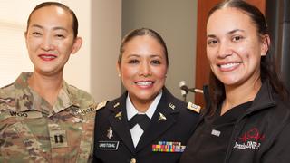 (L to R) Capt. Eunice Woo, Capt. Lydia Cristobal ’16 DNP and Jessica Ramos connect after the veterans recognition ceremony. Photo: Thomas Simpson
