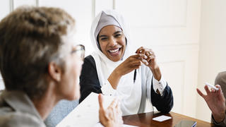 Woman smiling in conversation