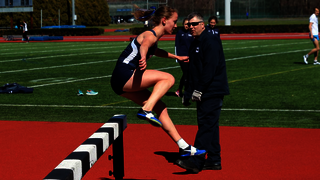 Photo of Meredith Rizzo '17 jumping track hurdle 