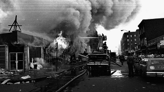 Photo of a building on fire from 1977