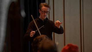 Samuel Hollister ’18, ’28 DMA, conducting the Yale Philharmonia