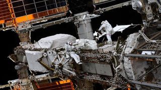 Astronauts installing a solar array on the International Space Station in 2021