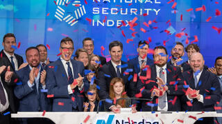 Founders and their families celebrate the launch of the National Security Emerging Markets Index ETF at the Nasdaq exchange