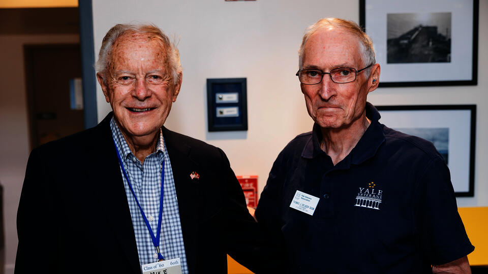 Mike Dickerson '60 and Tom Opladen '66, president emeritus of the Yale Veterans Association, pose side by side for a photo during the Yale Veterans Reception on the second weekend of 2022 Yale College Reunions.