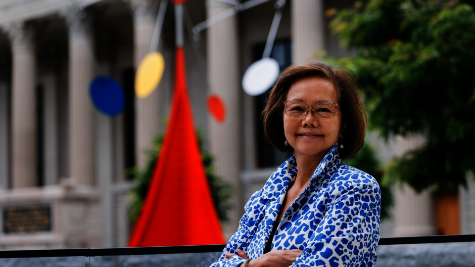 YAA Executive Director Weili Cheng '77 poses outside the Schwarzman Center