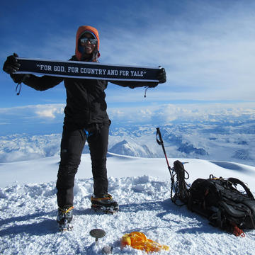 Abby Gahm '17 raises the Yale flag at the top of Denali.
