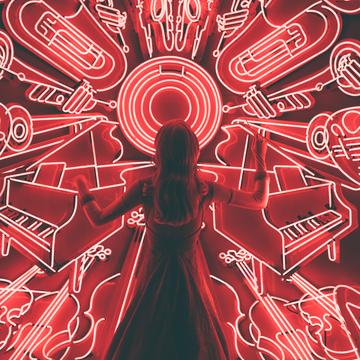 woman standing in front of musical instrument led display